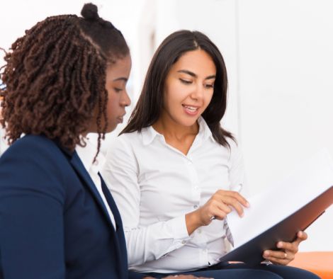 Two ladies discussing legal structure of a social enterprise