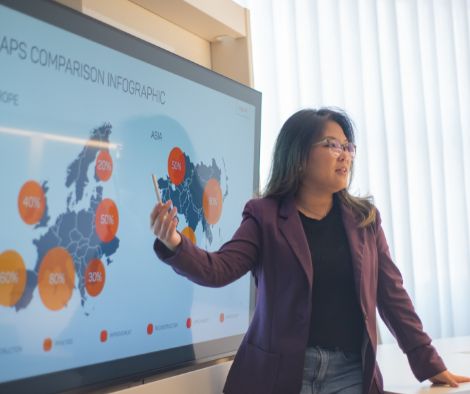 A lady presenting a market research for a social enterprise