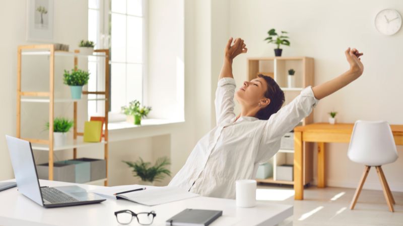 A businesswoman stopping work and taking time to relax and switch off