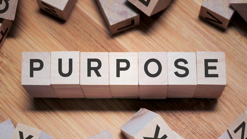 Word PURPOSE written in wooden cubes